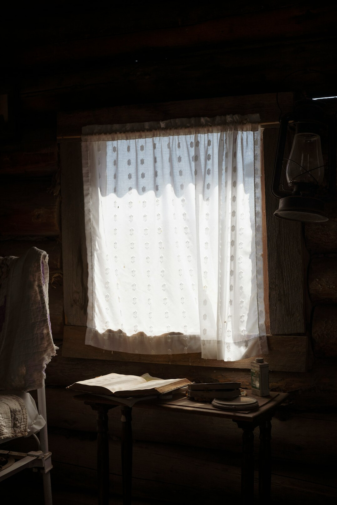 Desk with diary and pen by a window