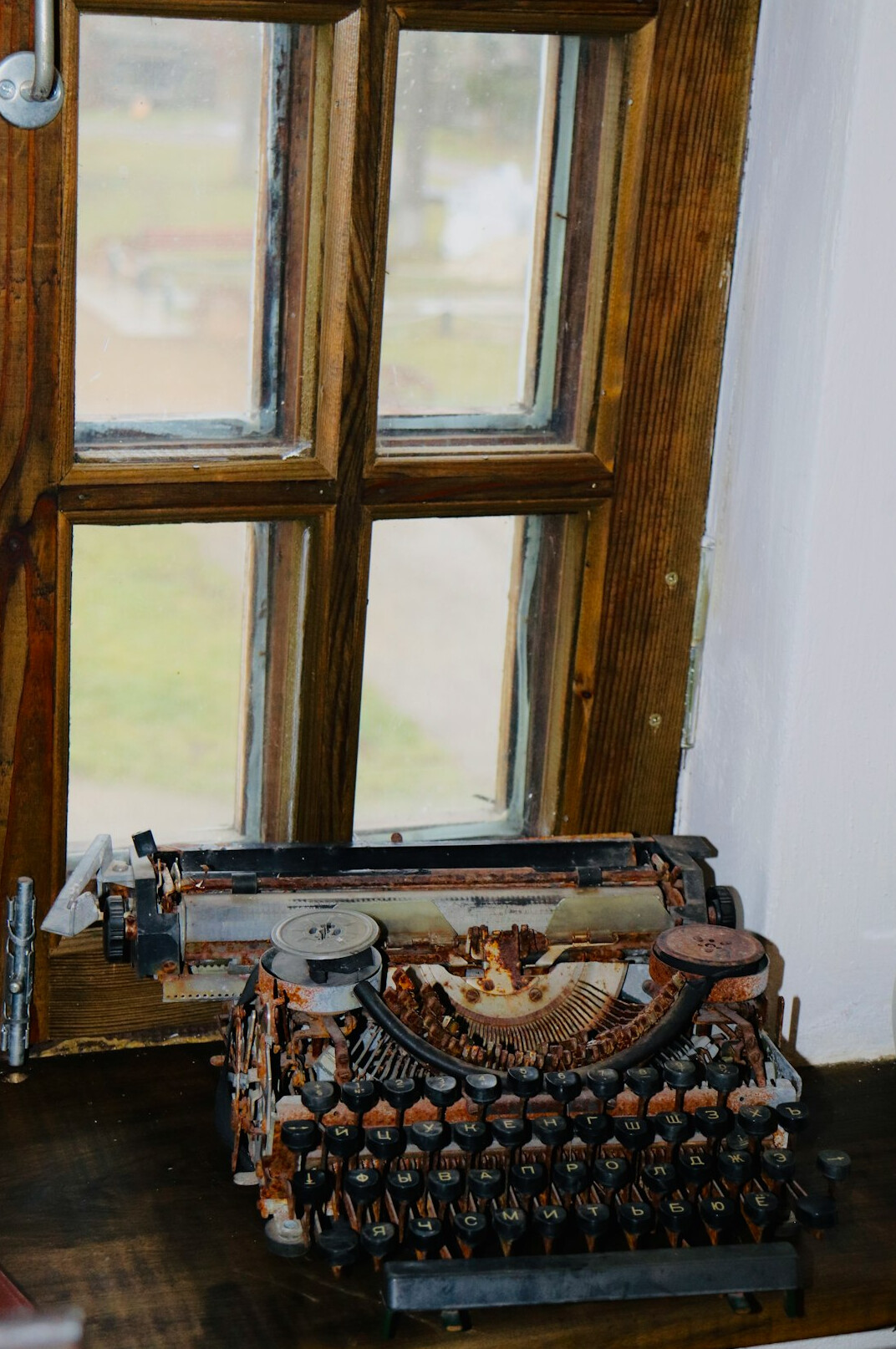 Vintage typewriter on a wooden desk with paper
