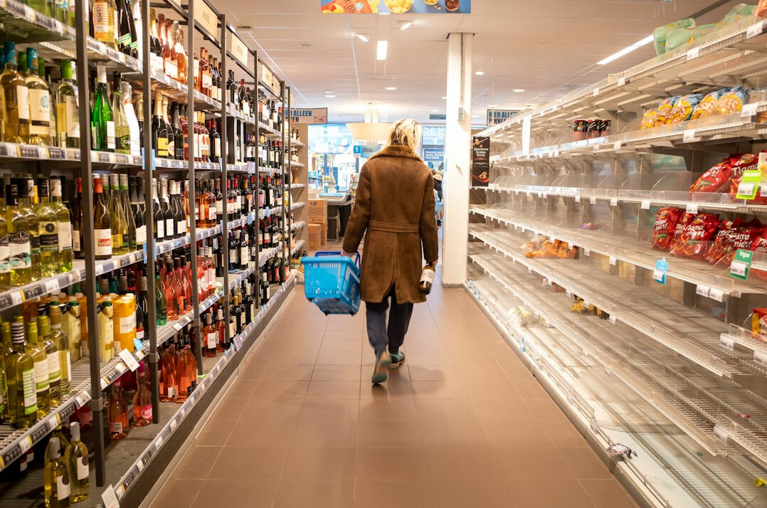 store detective monitoring supermarket