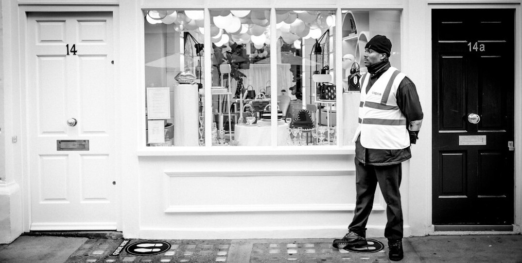 store detective watching shoplifter